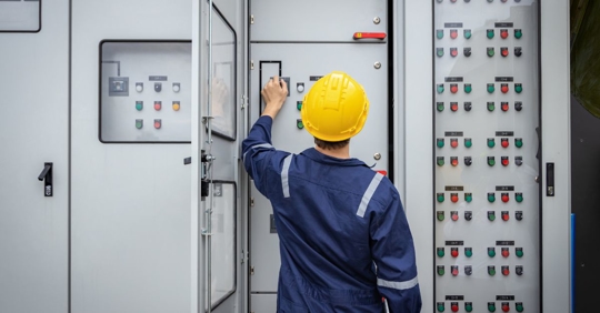 electrician looking at commercial system